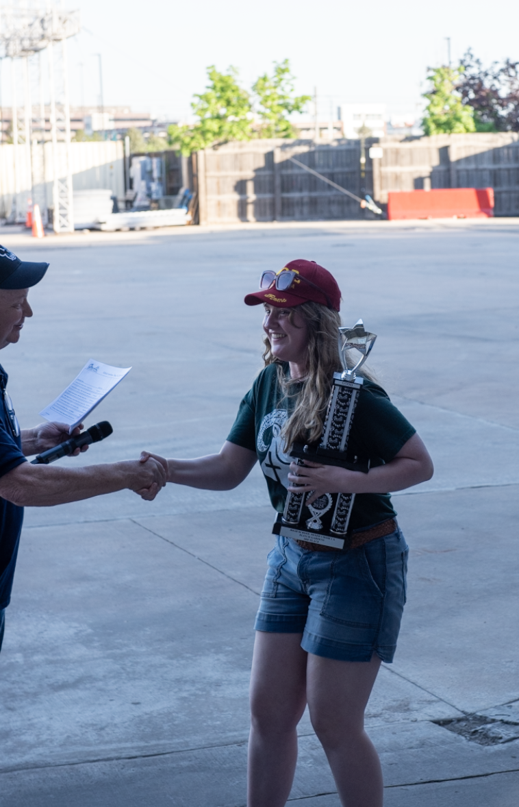 5.10.25 Senior Halle Anderson receiving Billings Central’s Choir’s third place trophy for Class A. 